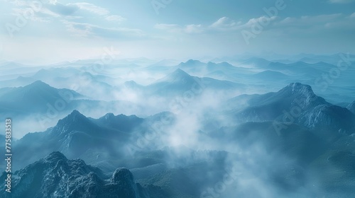 Misty mountain tops cloaked in morning fog
