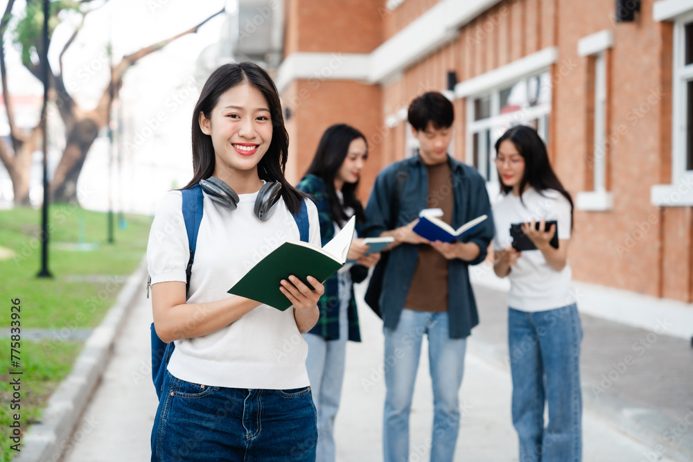 Obraz premium Diverse group of young adults from Asia and beyond, enjoying university life together. happy, learning, and making lifelong friendships, whether in outside class, sunny summer days or cozy weekends