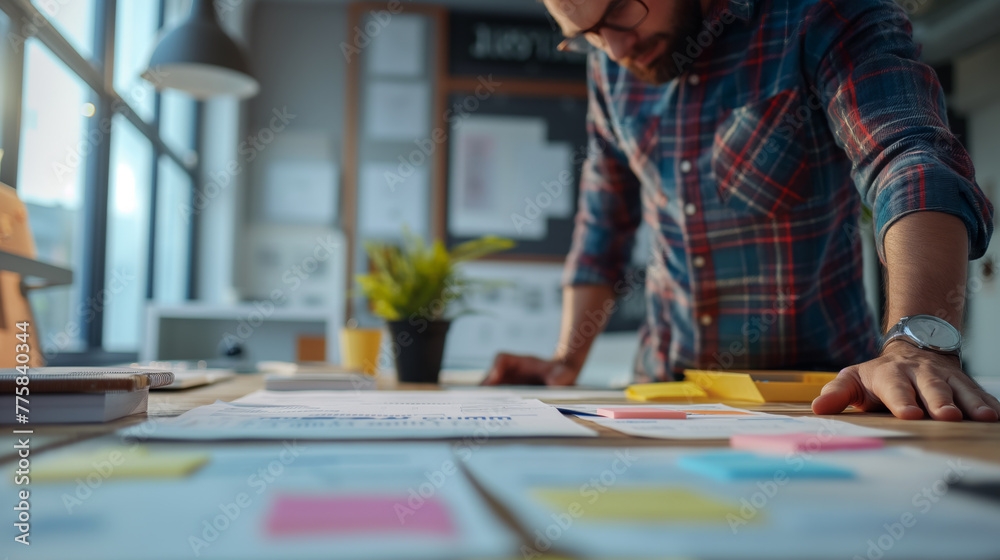 A designer immersed in a brainstorming session, connecting points with colorful paper patches under bright window lights A designer immersed in a brainstorming session, connecting points with colorful paper patches under bright window lights