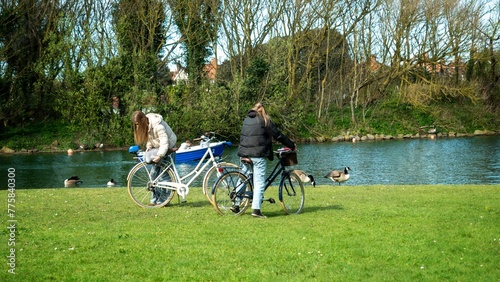 Two Girl Cyclists in a Park