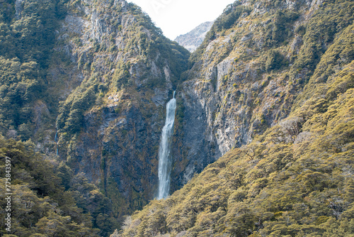 Devils Punchbowl waterfall cascades amid lush NZ greenery, a jewel of Arthur's Pass photo