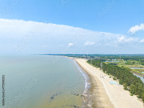 Wind power plant on the Baltic Sea coast in Zhanjiang, Guangdong, China © hu