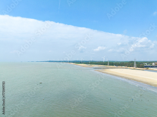 Fototapeta Naklejka Na Ścianę i Meble -  Wind power plant on the Baltic Sea coast in Zhanjiang, Guangdong, China