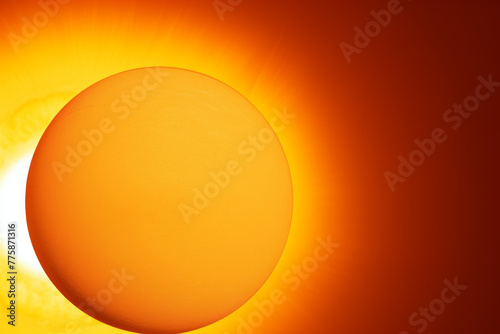 A close up of a sun with a bright orange glow