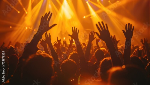 A crowd of people are at a concert, with their hands raised in the air by AI generated image