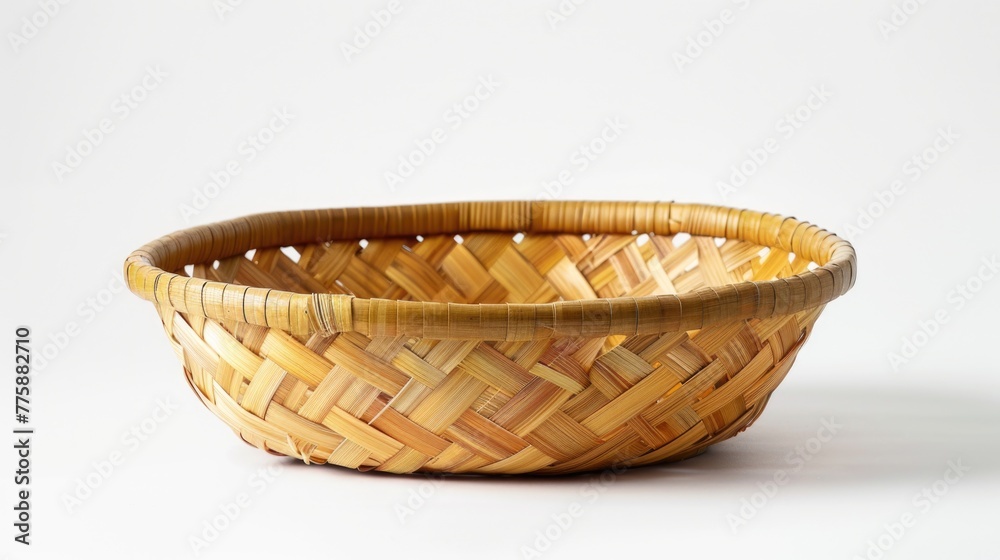 A simple image of a small woven basket on a clean white surface. Perfect for various design projects A simple image of a small woven basket on a clean white surface. Perfect for various design projects