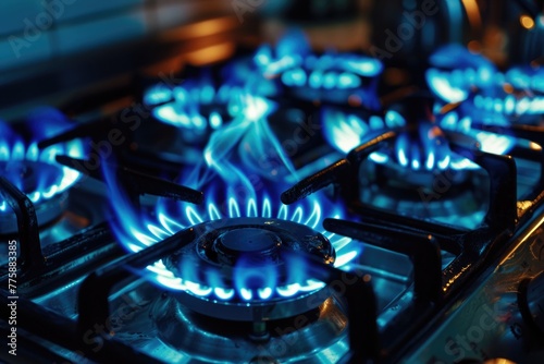 Close up of a gas stove with blue flames. Suitable for cooking or energy concepts