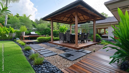 Beautiful outdoor living space with wooden decking and gazebo in the middle of the yard surrounded by nature