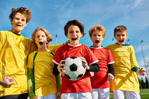 A diverse group of young people stands together  forming a circle  each person holding a soccer ball. They are smiling and appear enthusiastic and united  showcasing their love for the sport.