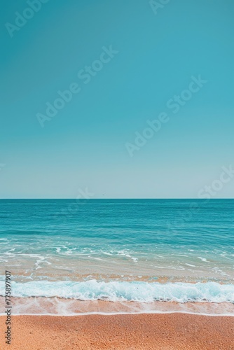 A scenic view of the ocean from a sandy beach, perfect for travel websites or vacation brochures