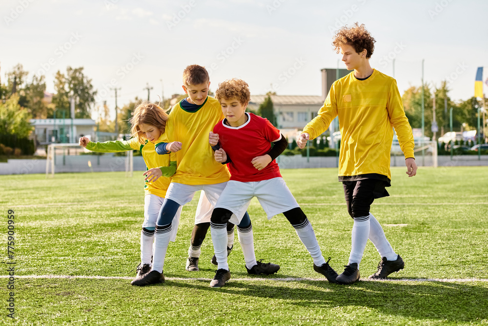 Obraz premium A group of energetic young boys, in their soccer jerseys, standing proudly at the peak of a soccer field, showcasing teamwork and camaraderie in the sport they love.