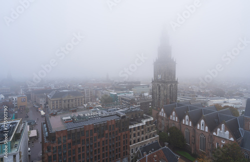 The Martinitoren on a foggy morning in the historical city centre of Groningen.