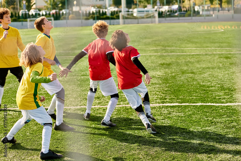 Obraz premium A group of young children joyfully play a game of soccer on a grassy field. They are running, kicking the ball, and cheering each other on, showcasing teamwork and sportsmanship.