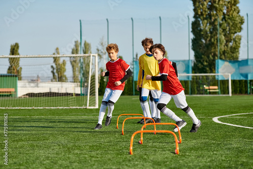A group of young boys enthusiastically playing a game of soccer, kicking the ball back and forth, sprinting across the field, and joyfully celebrating goals scored.