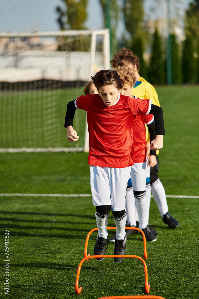 Obraz premium A group of young men exuberantly stand on top of a soccer field, united in celebration and victory after a hard-fought match. Their dynamic poses convey a sense of unity and camaraderie.