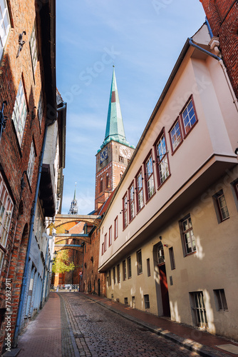 Scenic view old narrow european german Lubeck with red brick ancient houses vintage iron stained glass lamp lantern wall. Cityscape Lübeck UNESCO heritage city altstadt in Germany travel destination