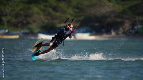 Kiteboarding in The Dominican Republic, Kiteboarder Doing a Trick, Beautiful Sunny Day, Tropics, Slow Motion 