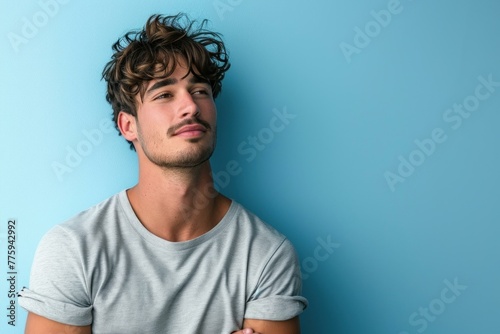 Fit Attractive young man on blue wall banner. Trendy style man at summer time. Generate Ai photo