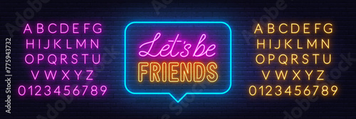 Lets Be Friends neon sign in the speech bubble on brick wall background.
