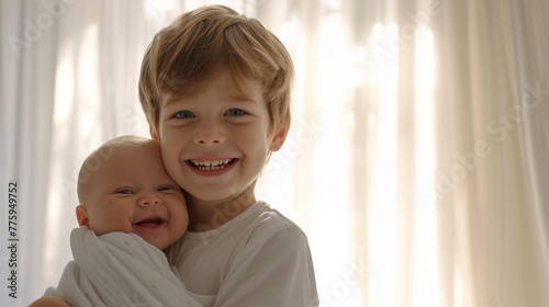 Happy baby and older brother photo