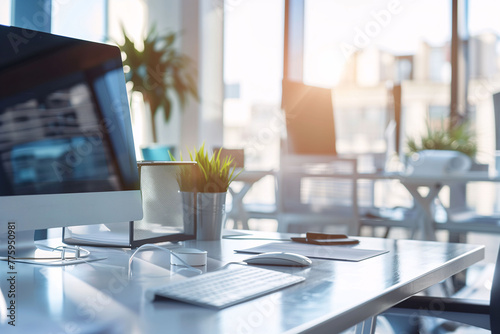 A contemporary office workspace basked in warm morning sunlight, featuring a computer monitor and ergonomic setup..