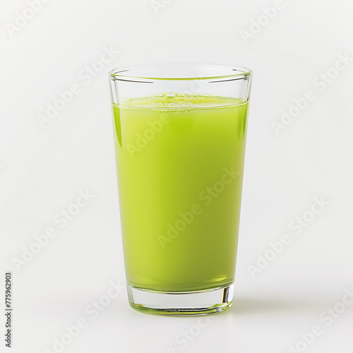 A glass of green juice on a white background. photo