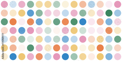 Fun abstract dotted background in rainbow colors. Faded colorful polka dots pattern. Circles confetti on beige background. Retro horizontal backdrop