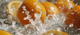 Oranges being splashed in water bowl