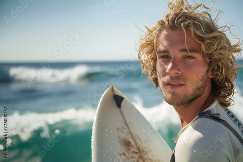 Young blond smiling man surfing