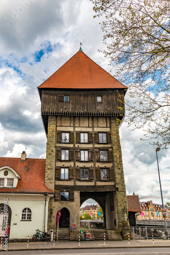 Lovely view of the medieval Rhine Gate Tower (Rheintorturm), built around 1200 as part of the Constance city fortifications. This imposing landmark stands between the old town and modern Constance.