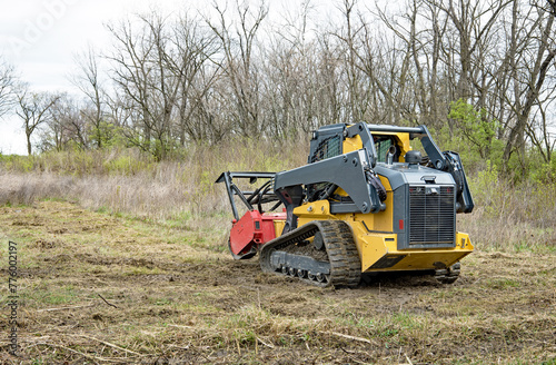 Forestry Mulcher Clearing Weeds, Rear View