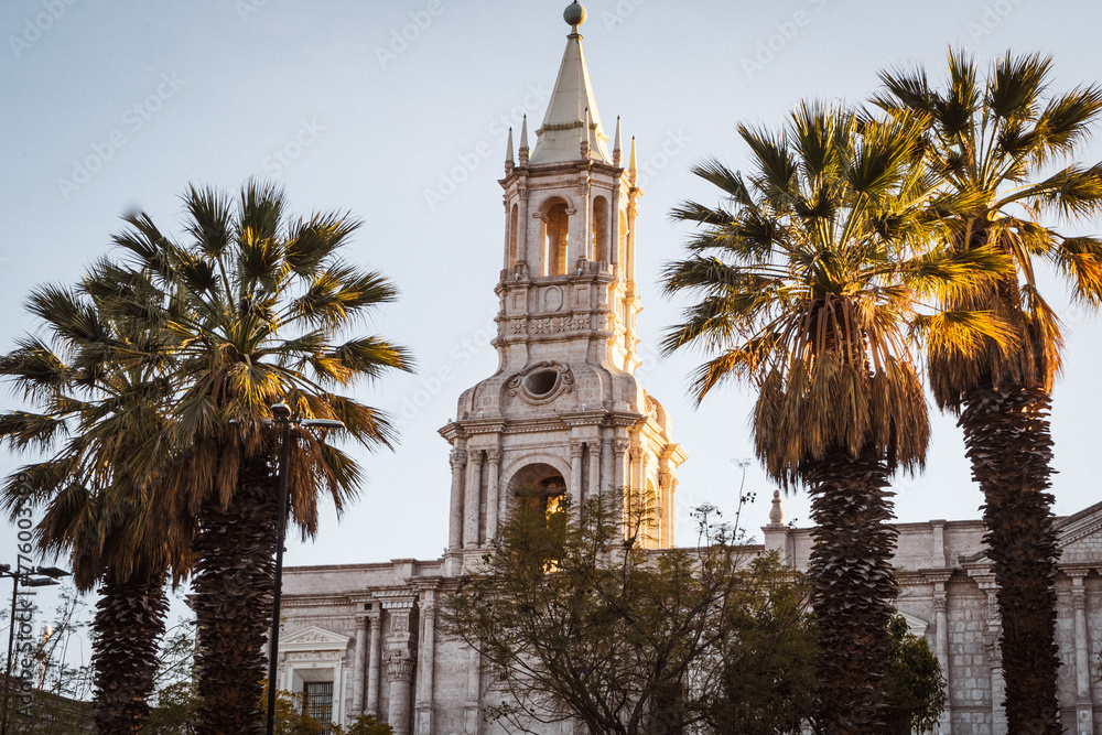 view over the main square and white stone church in Arequipa at sunrise