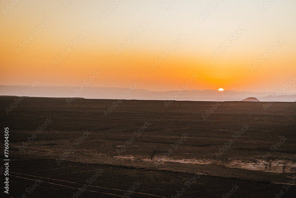 sunset over the Nazca lines in the desert