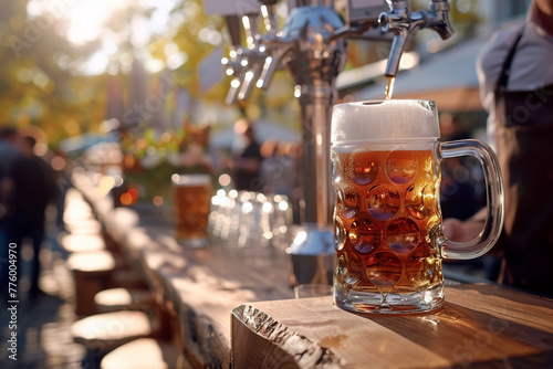 Beer pouring by bartender at Oktoberfest, side view, tap to glass action, bar setting photo