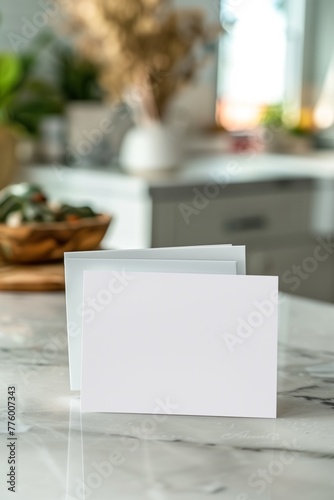Close-Up of White Cards with Kitchen Background