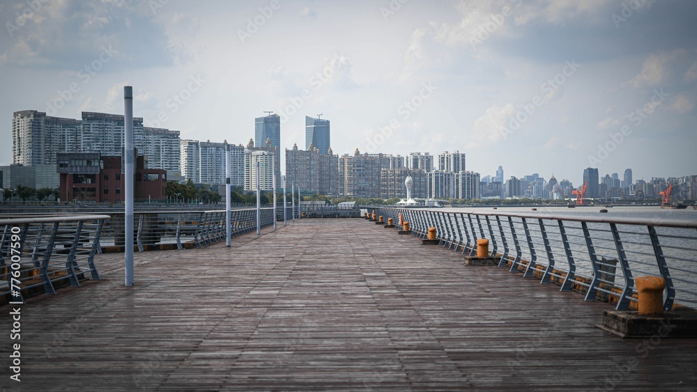 Pathway In the park with the background of the downtown and skyscrapers, Xu Hui District