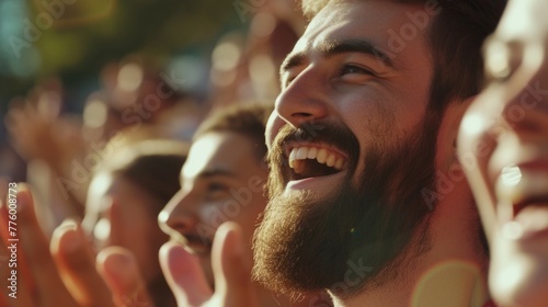 Portrait of a bearded man - a sports fan in the stadium stands photo