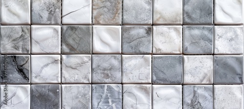 light grey tile wall background with different color and size of marble tiles. Abstract background with gray and white marble tiles, seamless texture for interior design or decoration.