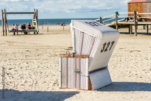 Cabin on the sandy shore in the St. Peter-Ording Germany with the North Sea in the background