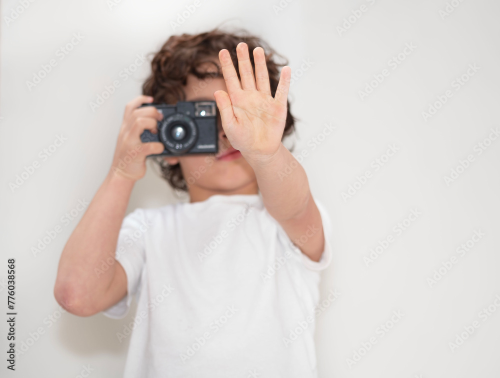A boy taking a photo using a analog camera A boy taking a photo using a analog camera