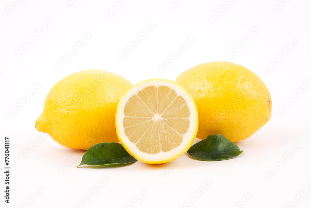 Fresh lemon with leaves on a white background