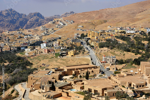 A high angle view of the modern hillside town of Petra, Jordan. 