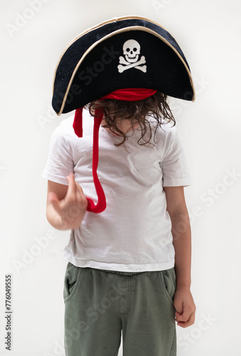 Child sporting a pirate hat with skull and crossbones design