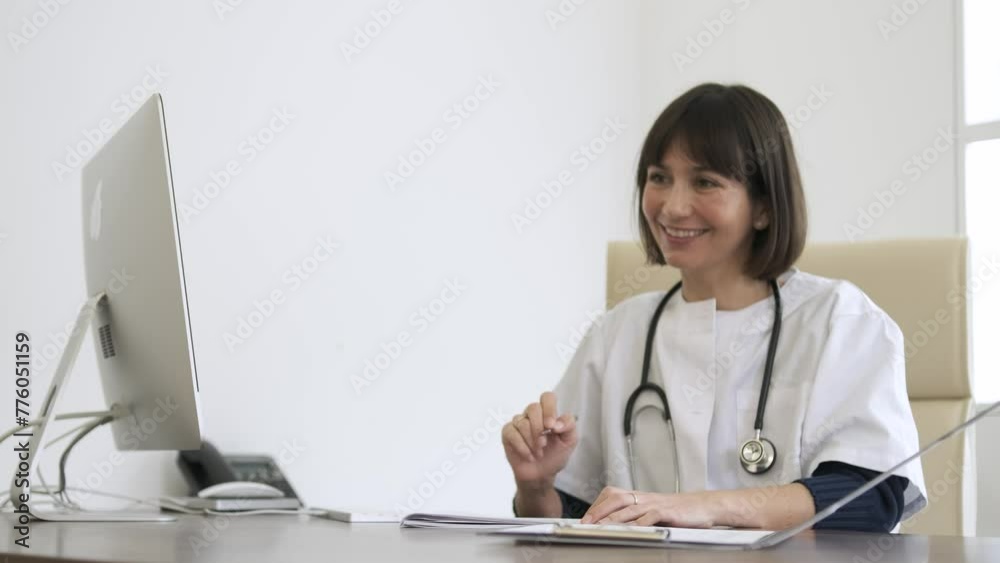 Happy female doctor giving prescription paper during consultation in clinic