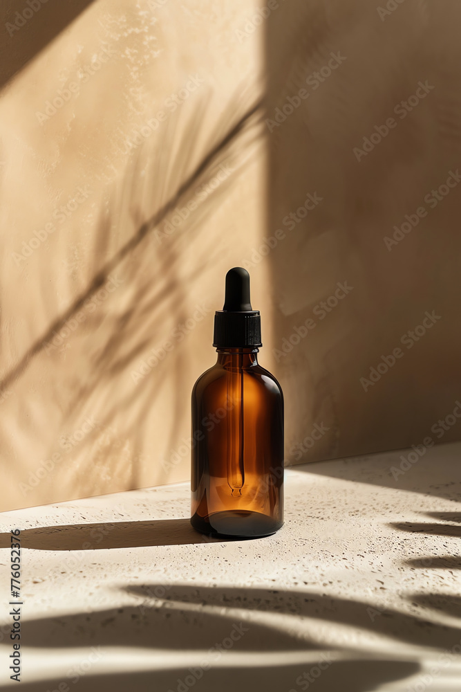 A brown glass bottle is placed on top of a wooden table. The bottle is ...