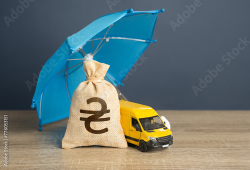 Yellow delivery van and ukrainian hryvnia money bag under an blue umbrella. Cargo and parcel insurance. Logistics security. Warranty obligations. Protection in conditions of military aggression