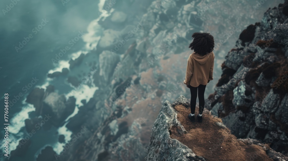 Obraz premium A woman experiences depression and despair, she stands on the gloomy edge of a cliff, mental illness and loneliness, AI generated