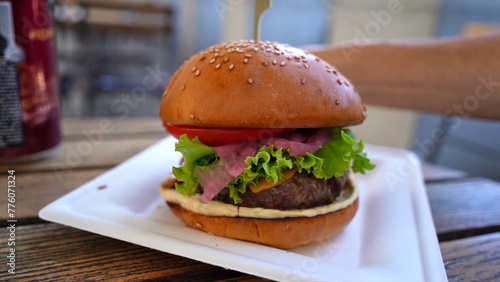 Meaty hamburger in a restaurant of Ljubljana, Slovenia, Feb 2024