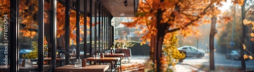 Capturing the serene ambiance of a contemporary café amidst autumn foliage, bathed in sunlight, devoid of human presence