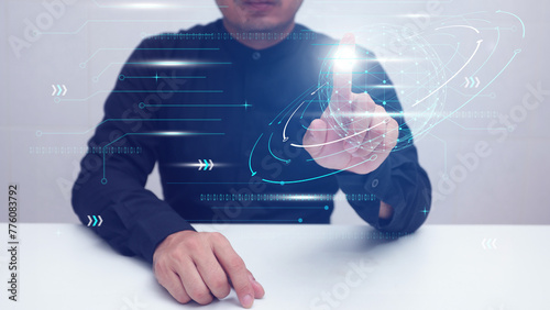 A man is pointing at a screen with the word technological on it